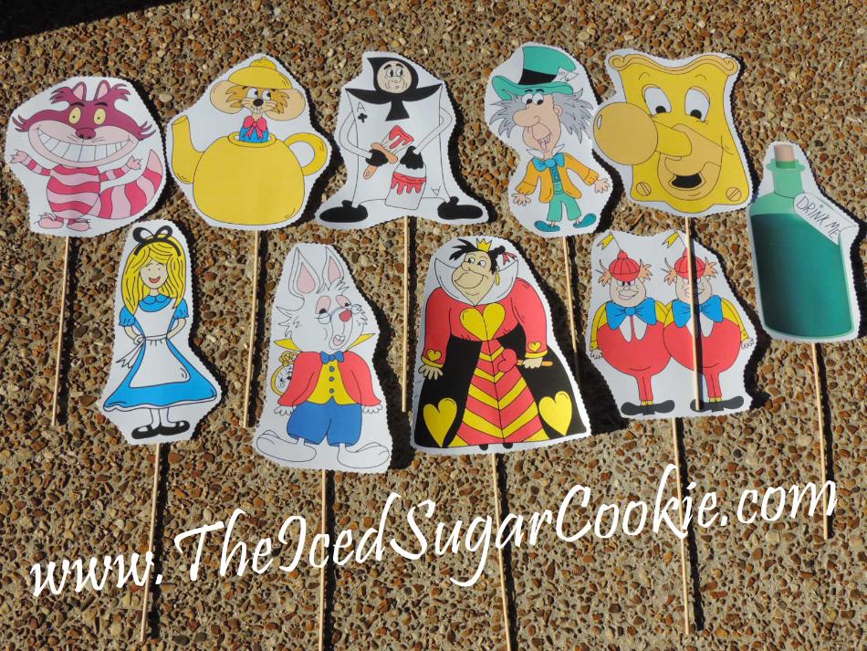 Free Alice In Wonderland Photo Booth Props by The Iced Sugar Cookie- Make your own DIY Alice in wonderland photo booth props.